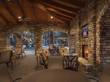 Poolside lounge area with fireplace at Villas at San Dorado, Arizona